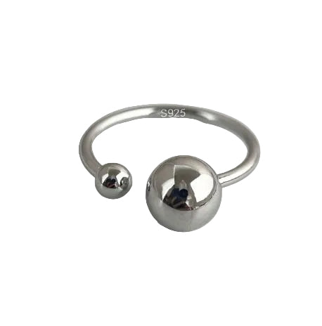Silver ring with two spherical ends on a light gray background