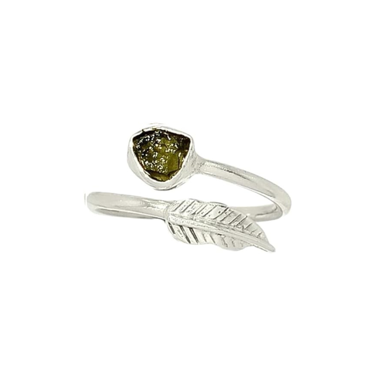 Silver ring with green stone and feather design on a white background