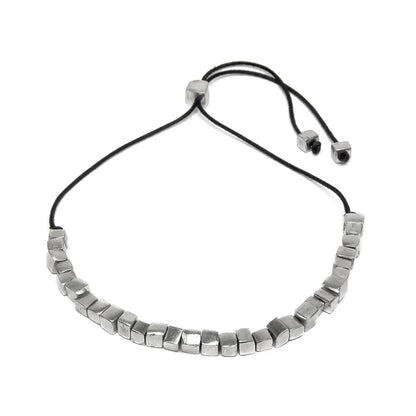 Vestopazzo Short Cube Necklace – Adjustable black cord choker with row of chunky silver cube beads on white background | Místika Style