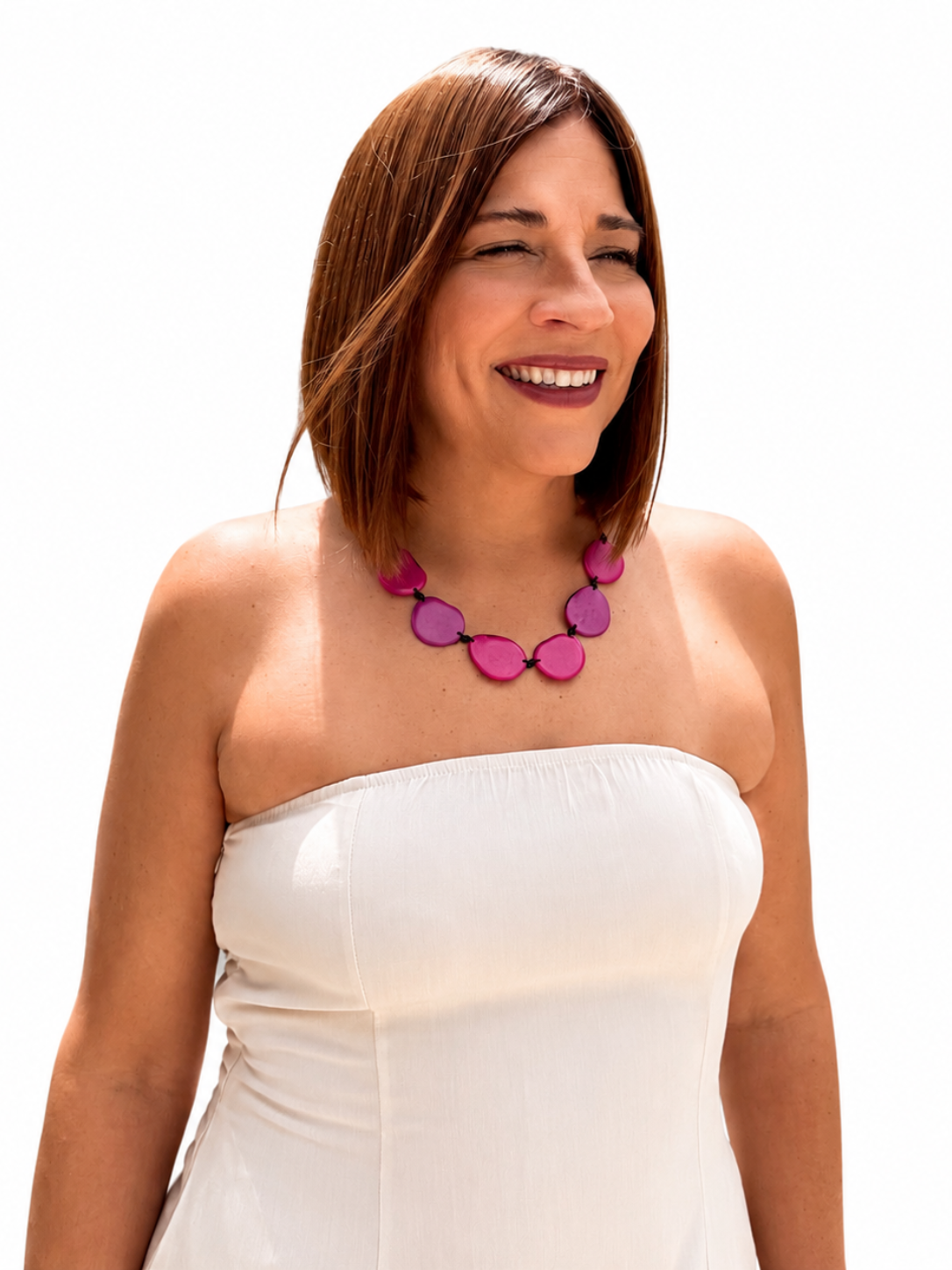 MÍSTIKA Tagua Sunlit Petals Necklace in Hot Pink – Smiling woman wearing fuchsia tagua necklace with white strapless top | Místika Style