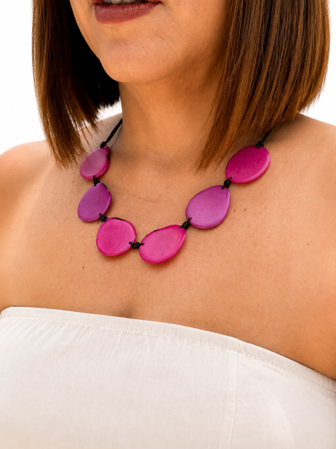 MÍSTIKA Tagua Sunlit Petals Necklace in Hot Pink – Lifestyle photo worn on model with white top | Místika Style