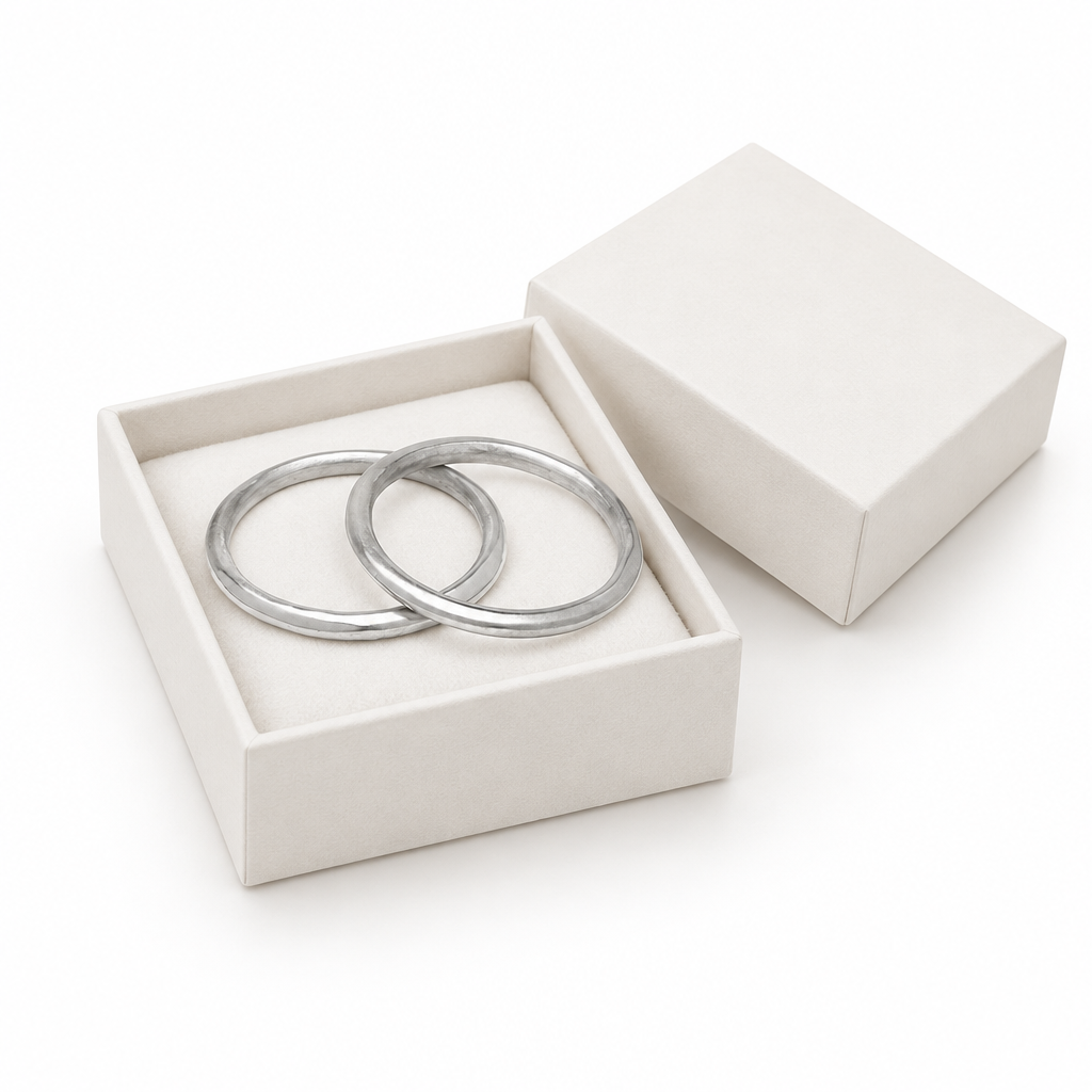 Silver rigid bangles in luxury white jewelry box
