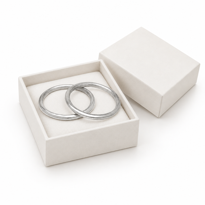 Silver rigid bangles in luxury white jewelry box